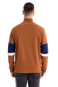 Detail of the back neck stitching on a brown and navy long-sleeve polo sweatshirt