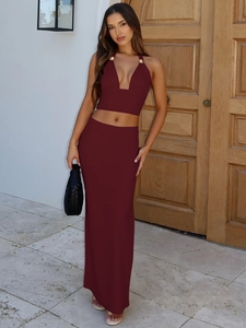 Chic burgundy two-piece set with a halter backless crop top and a maxi skirt for women