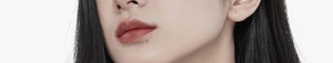 Detail of matte reddish-brown lipstick application on lips with smooth texture