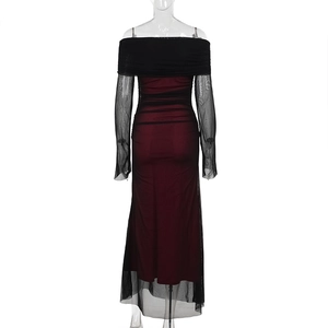 Detail of off-shoulder black mesh dress with deep red lining and sheer long sleeves