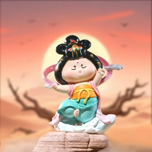 Dunhuang flying goddess figurine on rock base with sunset desert background scene
