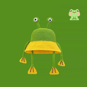 Cute green and yellow knitted frog bucket hat with big eyes and small feet features
