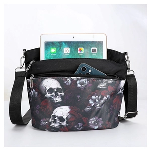 Detail view of gothic skull and floral crossbody bag showing spacious inner compartments