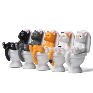Set of five cute cartoon cats sitting on white toilets for desktop landscape decoration