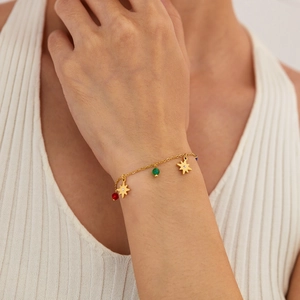 Chic gold stainless steel bracelet with star charm and colorful zircon beads on wrist