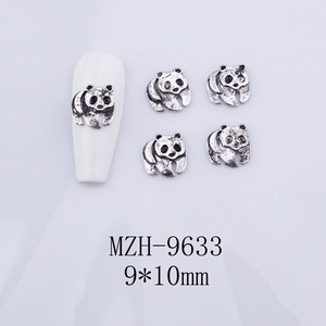 Macro view of 9x10mm panda nail charms in silver alloy for DIY manicure art