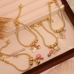 Elegant 18K gold plated charm bracelets with tulip and butterfly pendants in a gift box
