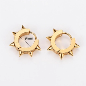 Detail view of 9mm gold punk spike hoop earrings with high-polish metallic finish
