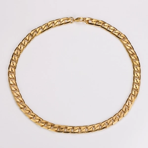 Detailed view of a gold plated 6DC Cuban chain bracelet with textured metal links