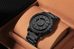 Macro detail of skull dial quartz watch with zodiac symbols and steel magnetic beads