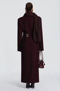 Back view of long slim-fit wool coat in burgundy with matching scarf and waist belt