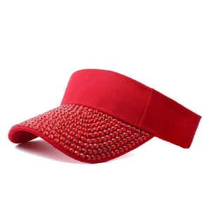 Detailed side view of vibrant red sun visor hat featuring dense red rhinestone embellishments