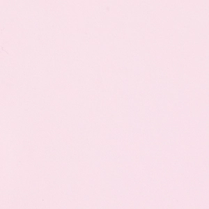 Macro detail of light pink dress fabric showing fine textile texture and soft color