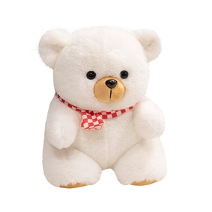 Plush teddy bear toy in white with red checkered scarf sitting in a front view shot