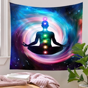 Detail of wall tapestry featuring seven chakra silhouettes and a cosmic galaxy nebula