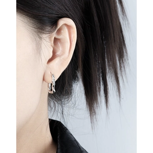 Elegant U-shaped silver hoop earrings with wavy texture and subtle zircon inlay