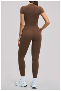 Rear view of tight brown long-sleeve yoga set with high-waist pants and matte finish