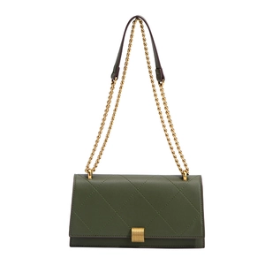 Elegant green quilted shoulder bag with golden chain strap and vintage metal lock