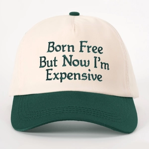 Two-tone baseball cap in off-white and dark green featuring Born Free embroidery