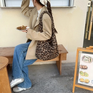 Close-up of leopard print faux fur tote bag showing plush texture and spacious design