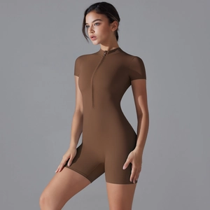 Close-up of side view on dark brown short sleeve yoga jumpsuit with front zipper