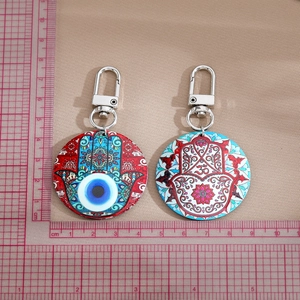 Bohemian evil eye and Hamsa hand mandala round keychains with silver metal spring rings