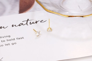Detail shot of the S925 sterling silver hallmark on the gold plated zircon stud earring