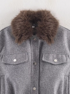 Detail of grey wool coat with brown faux fur collar and metallic buttons in size S