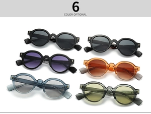 Close-up of retro round sunglasses showing metal arrow rivets and multi-color frame options