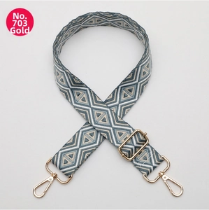 Adjustable wide replacement bag strap with blue and grey geometric jacquard and gold clips