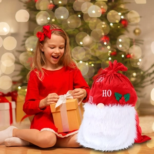 Red velvet Christmas drawstring gift bag with white fur trim and HO HO embroidery