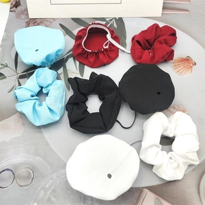 Set of 4 colorful drink cover scrunchies with caps in red, black, white, and blue