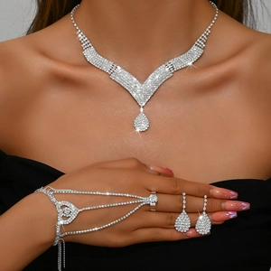 Elegant silver bridal jewelry set with sparkling rhinestones including necklace and earrings