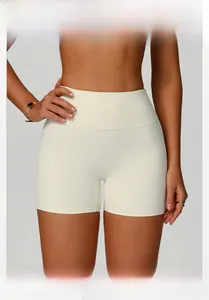 Macro detail of high-waist white sports shorts featuring wide waistband and elastic fabric