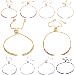 Detail of adjustable slider bracelets with cubic zirconia and metal plating in various colors
