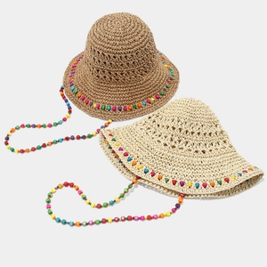 Chapeau de soleil en paille fait main avec perles colorées pour les vacances