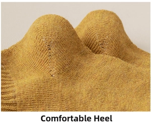 Close-up of comfortable reinforced heel on ginger yellow knitted cotton ankle sock