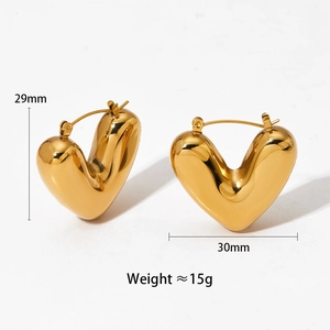 Detail view of 29mm x 30mm golden heart earrings showing exact size and weight dimensions