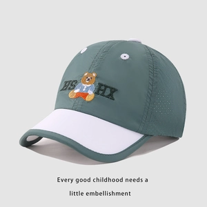 Detail of teal and white quick-dry kids baseball cap with breathable side laser-cut holes