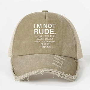 Detail of distressed khaki trucker hat showing worn brim and white printed text
