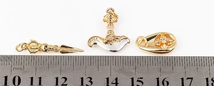 Detailed size measurement of micro-paved copper charms with millimetre scale ruler
