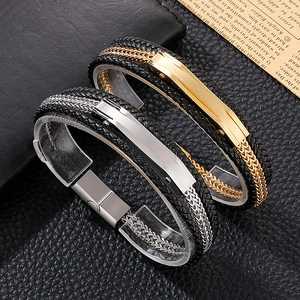 Detail view of woven black leather bracelet with polished gold and silver metal clasps