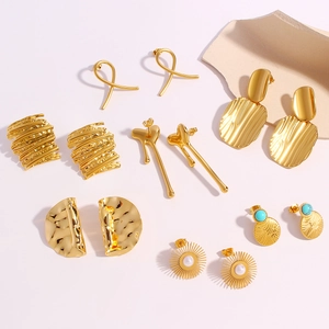 Set of 7 pairs of gold stainless steel floral and geometric earrings with pearls