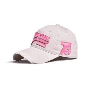 Close-up of vintage distressed beige baseball cap with pink Always 3D embroidery detail