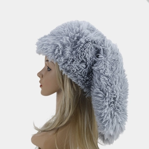 Detailed close-up showing the soft texture and fluffy gray faux fur of this winter beanie