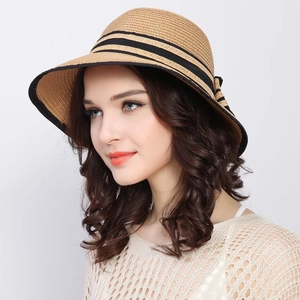 Women's foldable straw sun hat with black stripes and elegant bow on the side