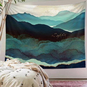 Detail of wall tapestry featuring abstract blue mountain peaks with gold line textures