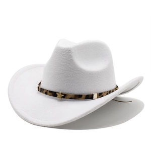Detail of white felt cowboy hat featuring leopard print band and golden star stud