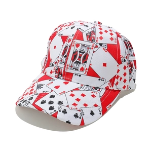 Close-up of poker cards pattern print on white cotton fabric of a punk baseball cap