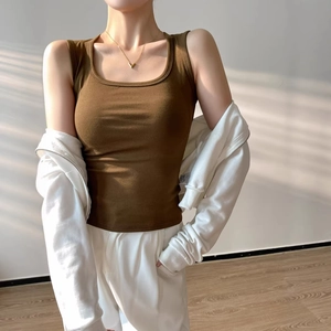 Women's brown cotton knit tank top and white hoodie set in a soft natural light setting
